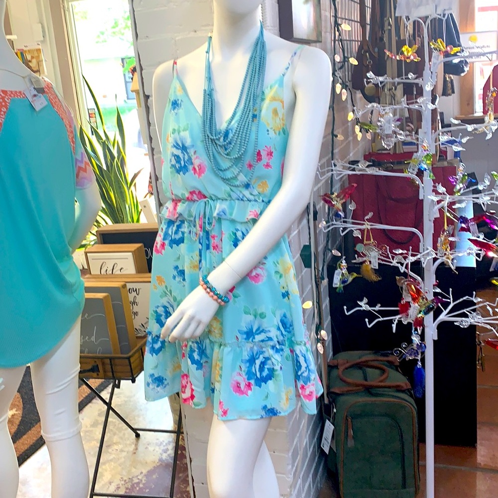 Sundress with spaghetti straps and ruffled hem.